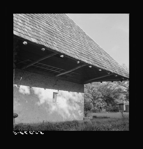 Untitled photo, possibly related to: Melrose, Natchitoches Parish, Louisiana. "African" house, probably storeroom, smokehouse, or jail when built by mulattoes, now part of John Henry cotton plantation, originally the Yucca Plantation (from Spanish). See general caption