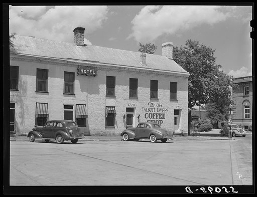 Untitled photo, possibly related to: Townspeople visiting while sitting in front of Old Talbott Tavern on Saturday afternoon. Bardstown, Kentucky