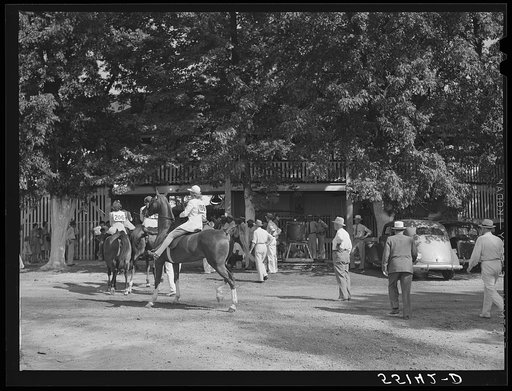 Entries in the best horsemanship class going into the ring at the Shelby County horse show and fair. Shelbyville, Kentucky