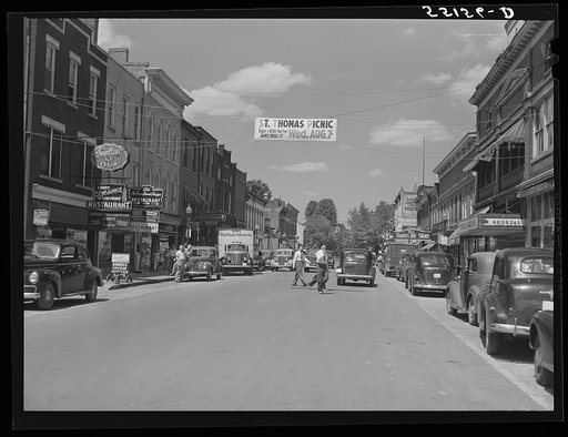 Center of town with banner advertising church picnic. Bardstown, Kentucky