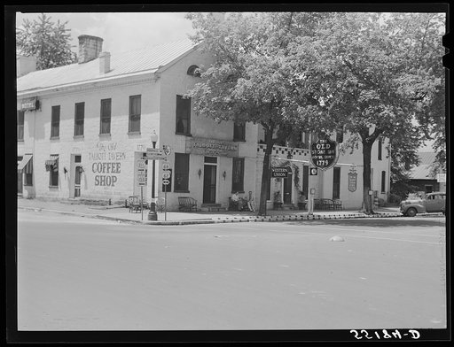 Untitled photo, possibly related to: Townspeople visiting while sitting in front of Old Talbott Tavern on Saturday afternoon. Bardstown, Kentucky