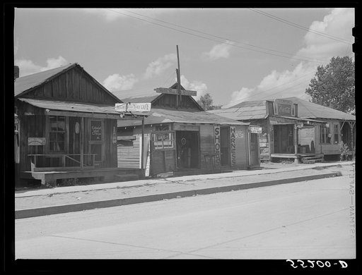 Untitled photo, possibly related to: Shoe and harness repair and beauty shop in store. Shelby, Mississippi Delta, Mississippi