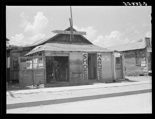Shoe and harness repair and beauty shop in store. Shelby, Mississippi Delta, Mississippi