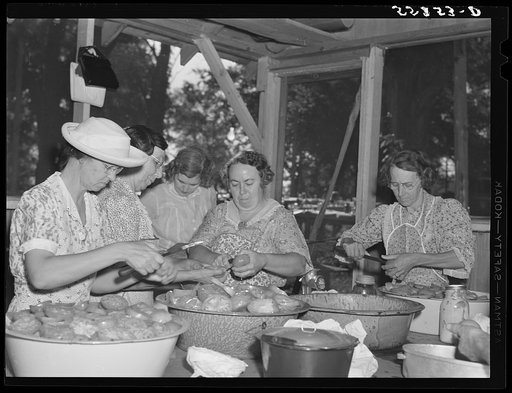 Parishioners peeling and slicing tomatoes for a benefit picnic supper on the grounds of Saint Thomas' Church. Near Bardstown, Kentucky