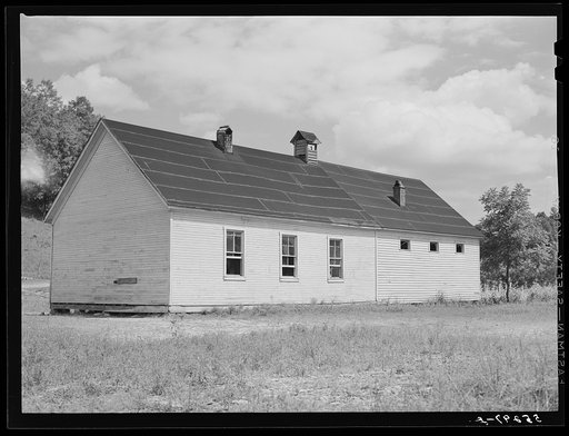 Untitled photo, possibly related to: Two-room school house near Morehead, Kentucky. In these mountain areas the school term begins in June and goes through January, because in the late winter and spring months the weather is so severe and roads so bad and children's' clothing is too inadequate
