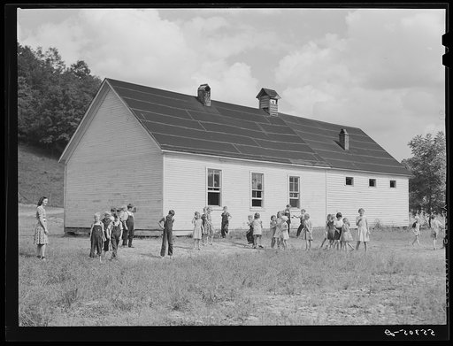 Two-room school house near Morehead, Kentucky. In these mountain areas the school term begins in June and goes through January, because in the late winter and spring months the weather is so severe and roads so bad and childrens' clothing is too inadequate