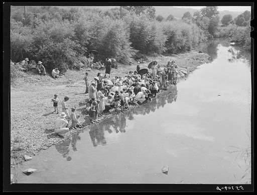 Members of the Primitive Baptist Church in Morehead, Kentucky, attending a creek baptizing by submersion