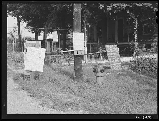 Signs in front of home near Anchorage, Kentucky