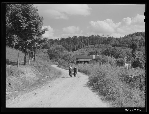 Children hauling water from nearby home to the school near Morehead, Kentucky