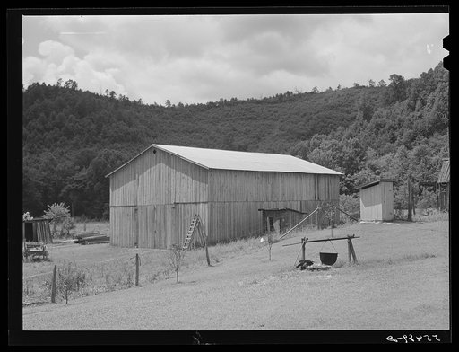 Prosperous farmer's new barn and old wash kettle near Morehead, Kentucky