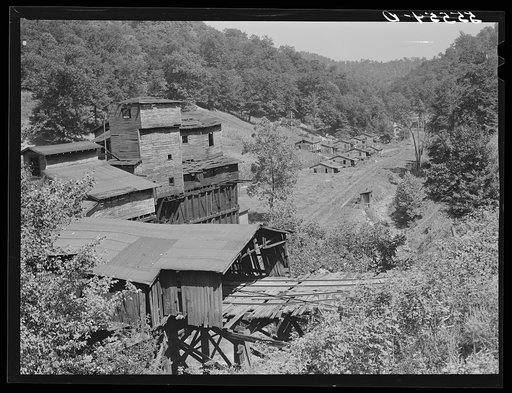 Abandoned tipple and coal miners' homes, some of whom still remain on relief, near Chavies, Perry County, Kentucky