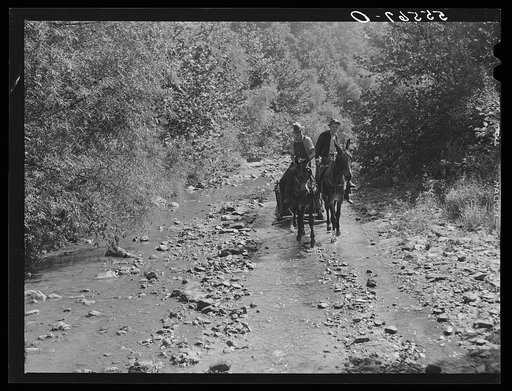 Mountaineers hauling coal up the creek bed to their homes. Morris Fork, Kentucky River, near Jackson, Kentucky