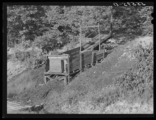 Mountain families in Kentucky "raise" their own coal in the back yard along roadsides. Up Morris Fork of Kentucky River
