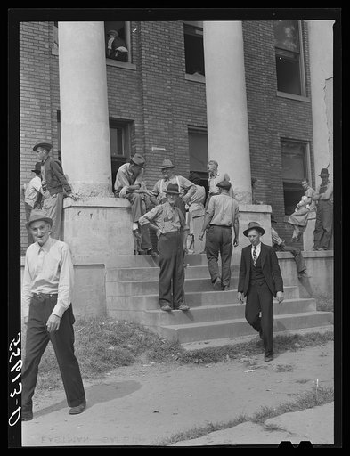 Mountain people and farmers exchanging news and greetings on court day on the steps of the courthouse. Campton, Wolfe County, Kentucky