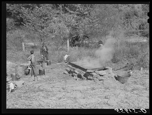 Homebuilt boiler pit made of mud and rocks where the sap from the sorghum cane is boiled down to the syrup. The man who does the cooking goes from one farm house to another and takes a share of the syrup for his work at the different mountaineers' homes in Breathitt County, Kentucky