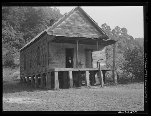 One-room schoolhouse showing overcrowded conditions and need for repairs and equipment. Breathitt County, Kentucky