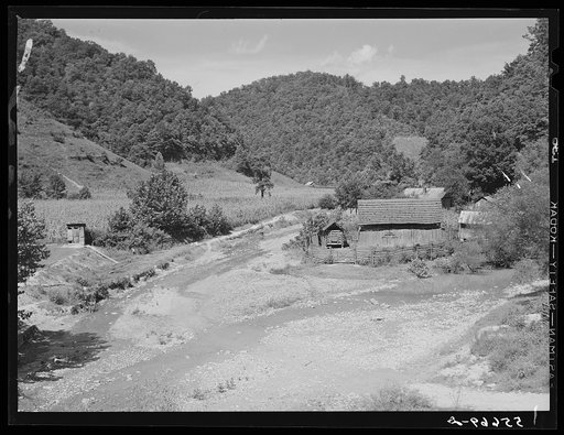 General landscape near Hyden, Kentucky showing mountain cabins, sheds and cornfields