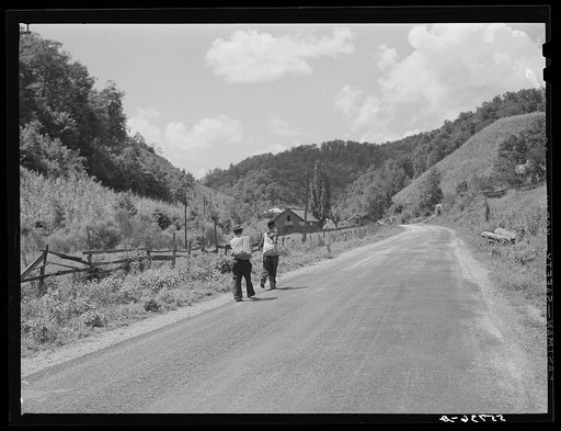 Mountaineers carrying home groceries and supplies from general store near Hyden, Kentucky