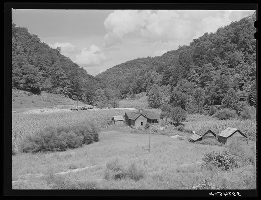 General landscape near Hyden, Kentucky, showing mountain cabins, sheds and cornfields