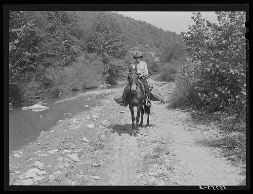 Rural mailman going up the creek bed toward Morris Fork near Jackson, Kentucky