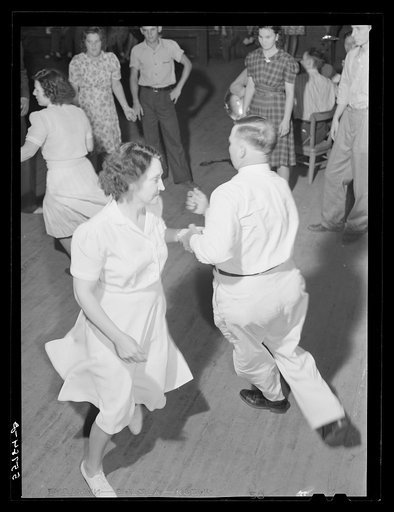 County superintendent at square dance party during school pie supper near Jackson, Kentucky