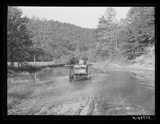 Mountaineers hauling coal up the creek bed to their homes. Morris Fork, Kentucky River near Jackson.  August 1940