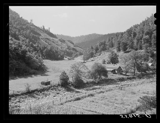 General landscape near Hyden, Kentucky, showing mountain cabins, sheds and cornfields
