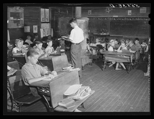 One-room schoolhouse showing overcrowded conditions and the need for repairs and equipment. Breathitt County, Kentucky