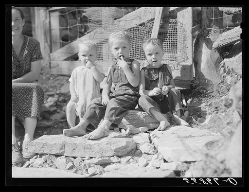 Children by the gate of their home up Stinking Creek, near Pine Mountain, Kentucky