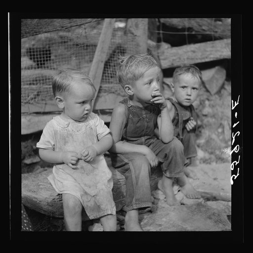 Mountain children on stone steps of their home. Up Stinking Creek, Pine Mountain, Kentucky