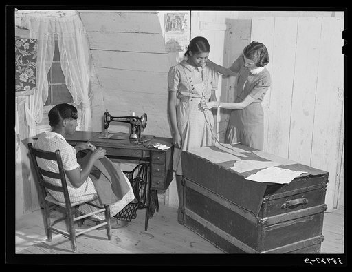 FSA (Farm Security Administration) home supervisor Miss Horton helping one of borrower's families cut pattern and make their own clothes. Caswell County, North Carolina