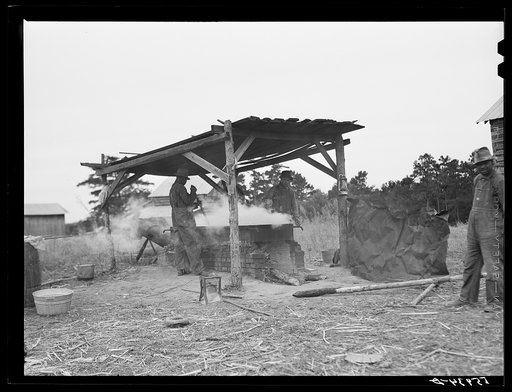 Boiling down the cane juice to make sorghum syrup. Caswell County, North Carolina