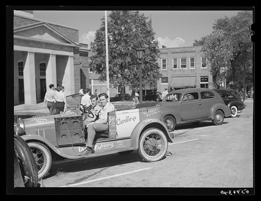 Untitled photo, possibly related to: University of North Carolina boys in their car in front of the post office. Chapel Hill, North Carolina