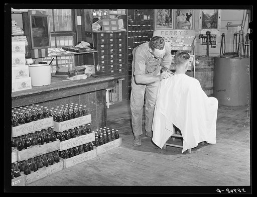 Free haircut on Saturday morning in W.M. Scott's general store. Farrington. Chatham County, North Carolina