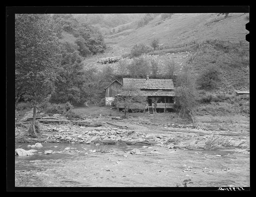 Farm house along creek bed in recently flooded area northwest of Asheville, North Carolina