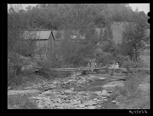 Farmhouses along creek bed in recently flooded area northwest of Asheville, North Carolina