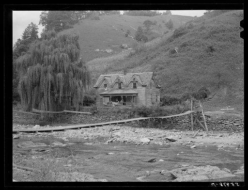 Farmhouses along creek bed in recently flooded area northwest of Asheville, North Carolina