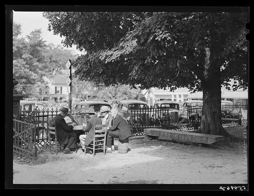 Men playing cards in yard in front of court house in Yanceyville, Caswell County, North Carolina
