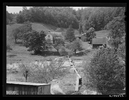 Farmhouses along creek bed on recently flooded area northwest of Asheville, North Carolina