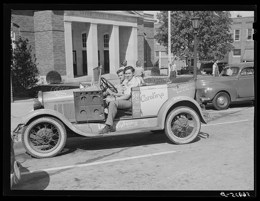 Untitled photo, possibly related to: University of North Carolina boys in their car in front of the post office. Chapel Hill, North Carolina