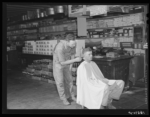 Free haircut on Saturday morning in W.M. Scott's general store. Farrington, Chatham County, North Carolina