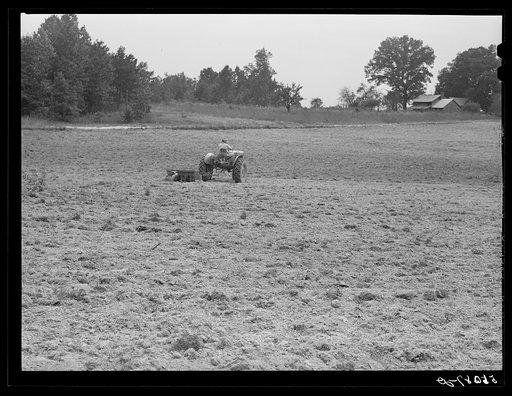 Untitled photo, possibly related to: Emery Hooper, discing neighbor's land in preparation for planting fall wheat with equipment purchased with a FSA (Farm Security Administration) co-operative community service loan. Caswell County, North Carolina