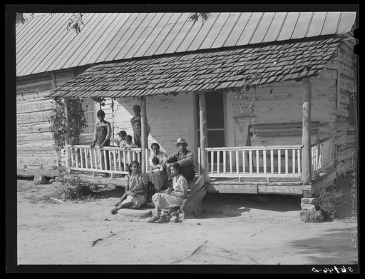 Untitled photo, possibly related to: FSA (Farm Security Administration) borrower's family, colored tenants, on porch of their home in Caswell, North Carolina