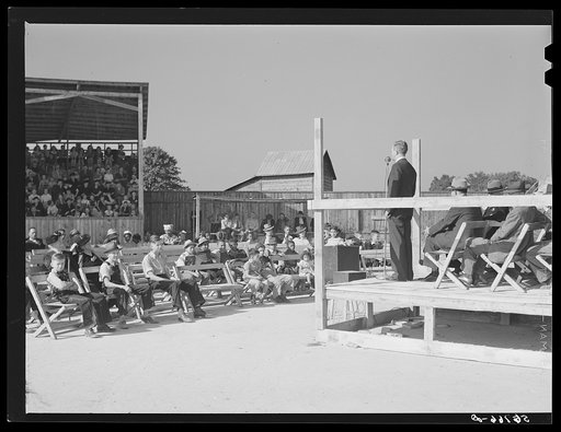 Listening to the county school superintendent and Governor Hoey speak at the Caswell County fair. Yanceyville, North Carolina