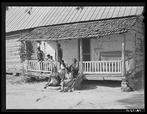 FSA (Farm Security Administration) borrower's family, colored tenants, on porch of their home in Caswell, North Carolina