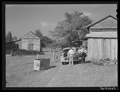 Untitled photo, possibly related to: During the tobacco marketing season peddlers drive around to the tobacco barns and strip houses through the county to sell their wares to the farmers and tenants. Caswell County, North Carolina