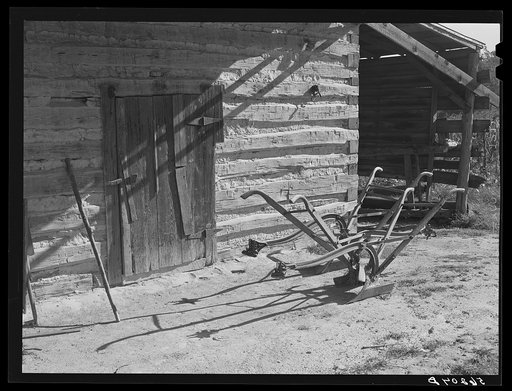 Untitled photo, possibly related to: Tobacco barn, now used for storing supplies, on Emery Hooper's farm in Corbett Ridge section near Prospect Hill. Caswell County, North Carolina