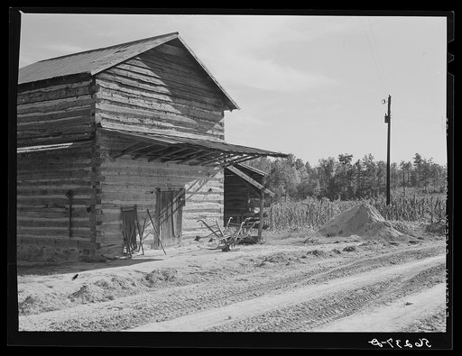 Tobacco barn, now used for storing supplies, on Emery Hooper's farm in Corbett Ridge section near Prospect Hill. Caswell County, North Carolina