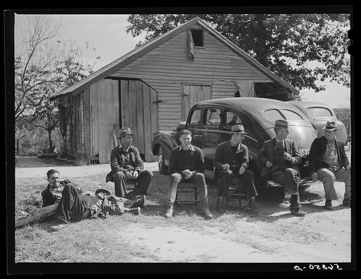 Resting after dinner following a corn shucking on Hooper Farm in Corbett Ridge section. Caswell County, North Carolina