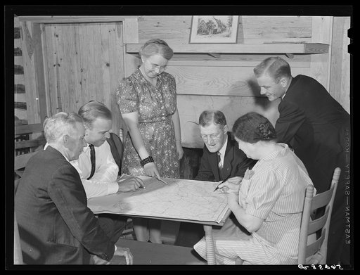 Untitled photo, possibly related to: Meeting of the neighborhood or community land use planning committee in Locust Hill. Studying and working on the map of Caswell County are Walter H. Williamson, also chairman of FSA (Farm Security Administration) tenant purchase committee; J.E. Zimmerman, county 